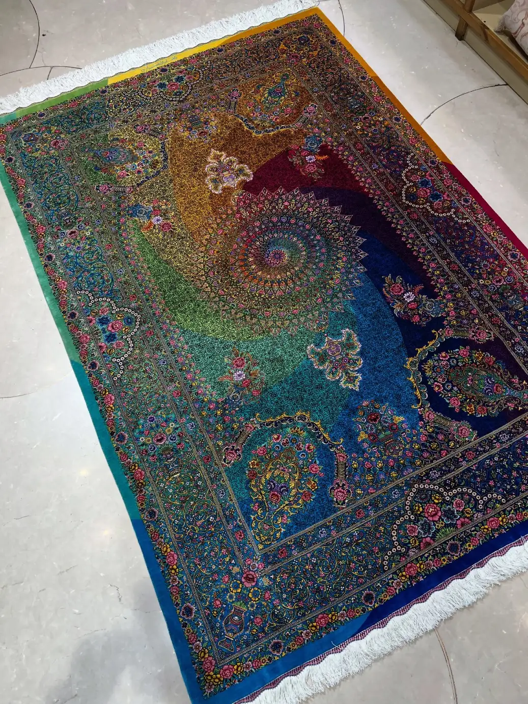 Full floor view of signed Qom silk carpet PRR-HM-001 with shifting blue green red and gold field