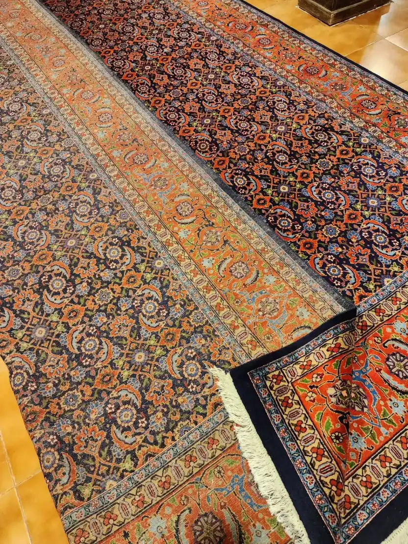 View of front and reverse textile surfaces on Tabriz Mahi carpet PRR-HM-012